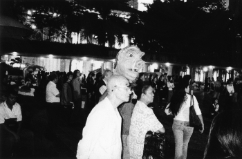 Audience and masked figure at the 'Art Action for Peace', Chater Gardens, Central, 27 October 2002