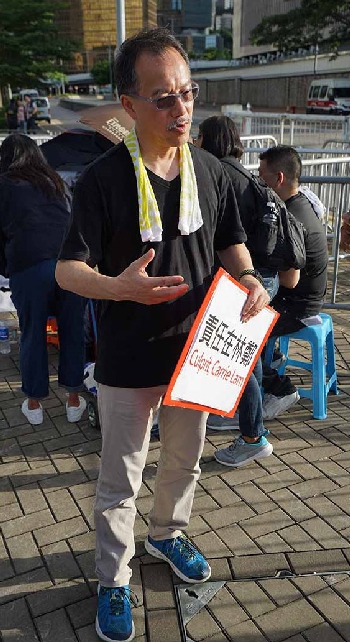 Legislator Fernando Cheung being interviewed near the entrance to the Central Government Offices Complex, Admiralty, 20 June 2019