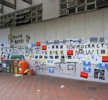 Graffiti and posters on a wall, Wanchai, 15 September 2019