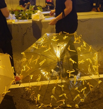 Umbrella decorated with yellow ribbons at the Central Umbrella Movement occupation site, Connaught Road Central, 1 October 2014