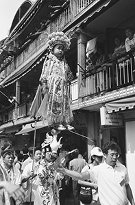 Children on a float, in procession through the streets of Cheung Chau during the island's annual bun festival, 22 May 1996