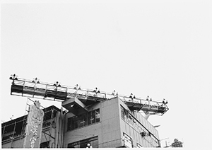 Building in Kowloon City with airport landing lights on its roof, 24 December 1996