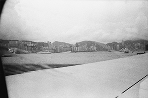 View of the harbour and Hong Kong Island from a plane taking off from Kai Tak airport a few days before it closure, 3 July 1998