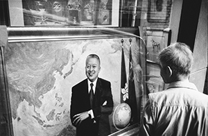 Portrait of designated future Chief Executive of the Hong Kong Special Administrative Region, Tung Chee-hwa, in a store window, Old Bailey Street, 9 May 1997