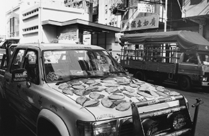 Fish being dried on the bonnet of a Toyota truck, Pei Ho Street, Sham Shui Po, 28 February 1997