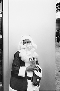 Father Christmas, outside a newly opened branch of Marks & Spencer, Queen's Road Central, 7 December 1996