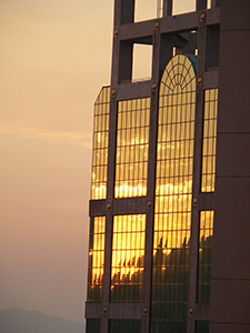 Sunset, with light reflected off a tower block, Sheung Wan, 3 December 2004