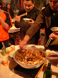 Pun Choi, a traditional New Territories meal, being served in celebration of the Lunar New Year at the Tang clan ancestral hall, Ping Shan, north-western New Territories, 11 February 2005