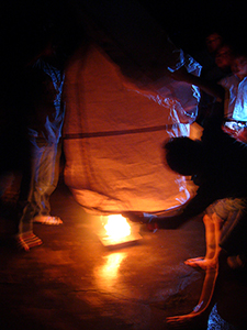 lnflating a paper hot air balloon prior to launch, as part of a traditional Mid-Autumn Festival celebration at Sheung Wo Hang Village, north-eastern New Territories, 18 September 2005