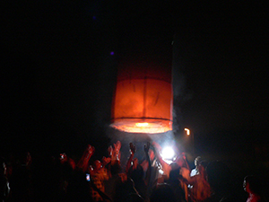 Launching a sky lantern during the Mid-Autumn Festival, Sheung Wo Hang Village, North East New Territories, Hong Kong, 7 October 2006