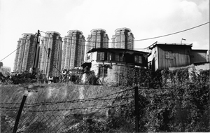 Diamond Hill, with squatter huts awaiting clearance and view of newer development Hollywood Plaza behind, 30 April 2001