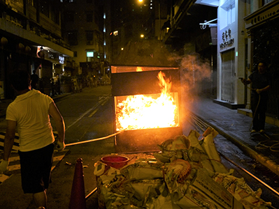 Burning offerings in a street brazier, Hungry Ghost Festival, Tai Ping Shan, 31 August 2012