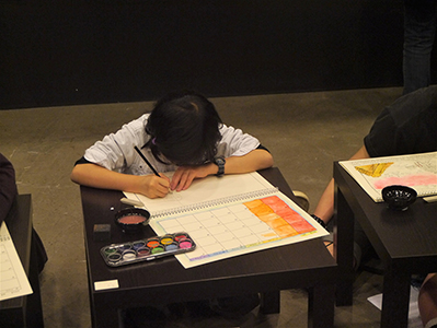 Song Dong's daughter participating in her father's  '36 Calendars' project, at Artistree, Taikoo Place, Quarry Bay, 21 January 2013