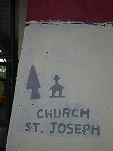 Hand-painted signage on a footpath near the top of Garden Road, 13 February 2013