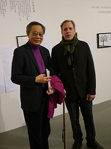 Leo Lee Au-fan (left) and Gérard Henry, at the opening of a memorial exhibition for Leung Ping-kwan in the basement of the Central Library, Causeway Bay, 9 January 2014