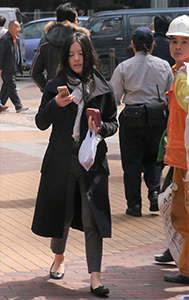 Using a smartphone while walking, Sheung Wan, 24 February 2014