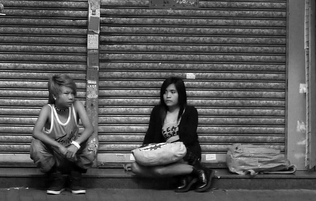 Resting in front of a closed shop on a public holiday, Sham Shui Po, 3 February 2014