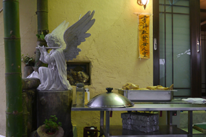 Religious statuette in a restaurant serving Hakka food on the island of Yim Tin Tsai, Sai Kung, 6 April 2014