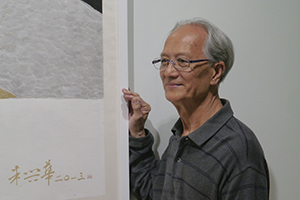 Artist Chu Hing Wah with one of his paintings at an exhibition opening at Hanart TZ Gallery, 16 April 2014