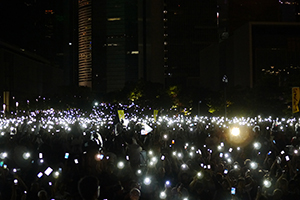 Singing along with phone flashlight accompaniment at a rally at the Tamar site to launch the Occupy Central movement, 31 August 2014