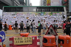 Bus barricade with posters at the Mongkok Umbrella Movement occupation site, 30 September 2014
