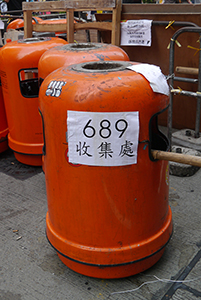 Rubbish bins with poster referencing Leung Chun-ying at the Mongkok Umbrella Movement occupation site, 30 September 2014