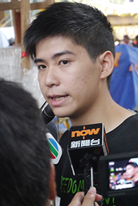 Student leader Lester Shum being interviewed at the Admiralty Umbrella Movement occupation site, Harcourt Road, 2 November 2014