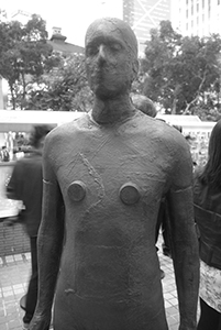 One of the sculptures from Antony Gormley's Event Horizon project, installed in Statue Square, 19 November 2015