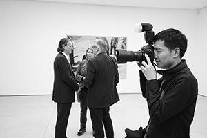 Photographer Jeff Wall (left, background) at the opening of his exhibition, White Cube Gallery, 50 Connaught Road Central, Central, 10 December 2015