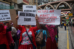 Domestic helpers protesting against their work situation, in the protest march from Causeway Bay, 1 July 2016