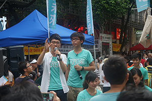 Nathan Law (left) and Joshua Wong (right), leaders of the Demosisto political party, addressing demonstrators on the annual democracy march, Wanchai, 1 July 2016