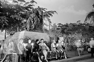 Protesters at the June Fourth Memorial Rally in Victoria Park, beneath the statue of Queen Victoria, 4 June 1999