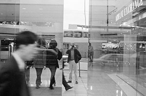 Entrance to the Pacific Place shopping centre, with reflections of the traffic on Queensway, 12 April 1996