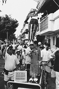 Float with topical references, Cheung Chau Bun Festival, 22 May 1996