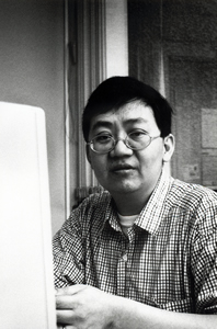 Artist and curator Oscar Ho in his office at the Hong Kong Arts Centre, 13 April 1995