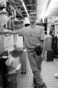 Shopkeeper in his shop, Ma Tau Kok Road, Kowloon, 28 June 2017