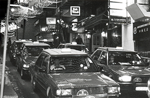 Taxis, late evening, D'Aguilar Street, Central, 12 December 1995