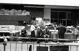 People sitting on a bench, O'Brien Road, Wanchai, 28 January 1996