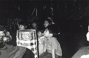 Children watching a Wayang Kulit shadow puppet performance, Loke Yew Hall, Main Building, University of Hong Kong, 9 February 1996