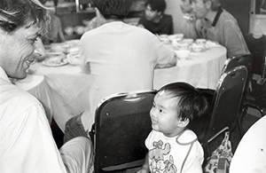 Gerard Henry and a young friend, in a restaurant in Central, 19 June 1996