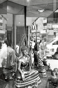 Buddha statue in a shop window, with reflection of McDonald's sign, Queen's Road West, Sheung Wan, 6 September 1996