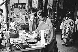 Daoist priest performing rituals associated with a once-every-ten-years purification ceremony at Shek O, 26 October 1996