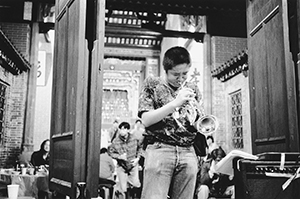 Solo jazz trumpet performance at a New Year's eve party in the Tang clan ancestral hall, Ping Shan, 31 December 1996