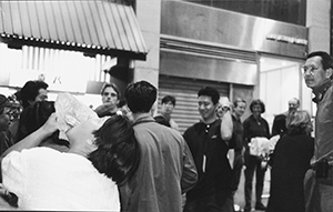 Film director Wayne Wang (right), actor Jeremy Irons (centre left, rear), plus extras involved in the shooting of a 'handover night party' sequence in Lan Kwai Fong for the movie Chinese Box (1997), Central, 13 March 1997