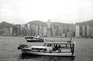 Hong Kong skyline with pleasure junks in Victoria Harbour, 25 March 1997