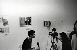 Media interview taking place at the opening of the 'Souvenir for 1997' exhibition, Hong Kong Arts Centre, 9 April 1997