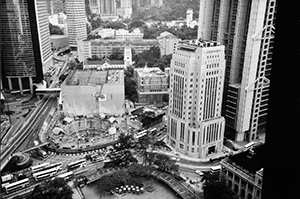 The foundations for the Cheung Kong Center being laid on the former site of the Hilton Hotel: view from the revolving restaurant of the Furama Hotel, Central, 20 May 1997