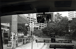 Reflection of passengers on a mirror inside a minibus, Victoria Road, 20 July 1997