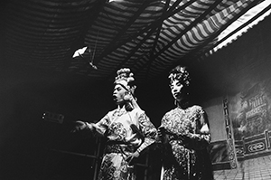 Chinese opera performance for the Hungry Ghost festival being given in a store front, Tung Street, Sheung Wan, 17 August 1997