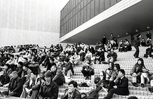 Audience listening to a rock group playing music outside the Cultural Centre, Tsim Sha Tsui, 8 February 1998